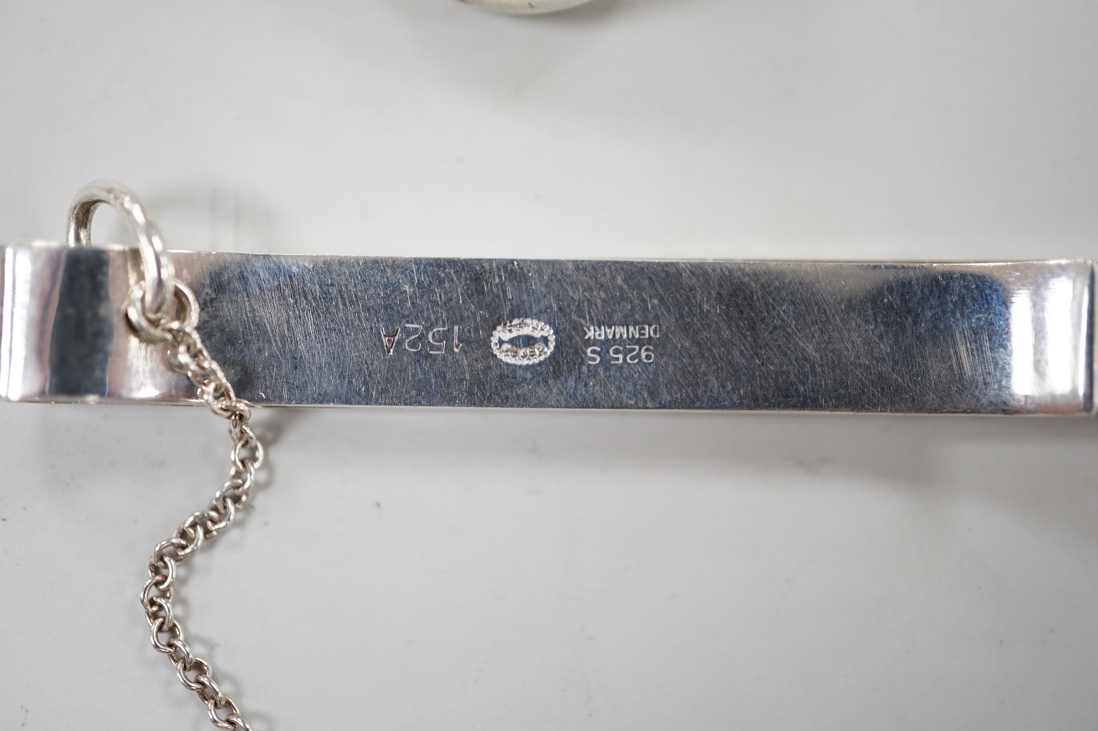 A Georg Jensen sterling pierced heart ring, size N and a Georg Jensen two colour sterling tie clip, design no. 152A, 58mm.